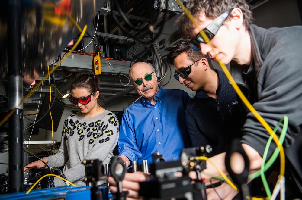 University of Chicago Professor David Awschalom (second from left), an Illinois Physics alumnus, a senior scientist at Argonne, and the director of the Chicago Quantum Exchange, works in his lab with postdoctoral trainees. Photo by Jean Lachat for UChicago
