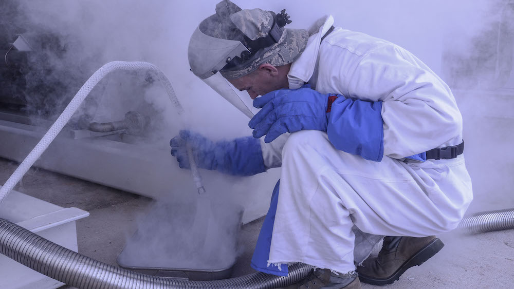 Airman 1st Class Nathanael Markley, 36th Logistics Readiness Squadron cryogenics lab technician, releases gaseous liquid oxygen into a beaker on Andersen Air Force Base, Guam. The 36th LRS cryogenics production technician team is one of two base-level cryogenics teams left in the Air Force that still makes all of its own products. (U.S. Air Force photo by Airman 1st Class Adarius Petty)