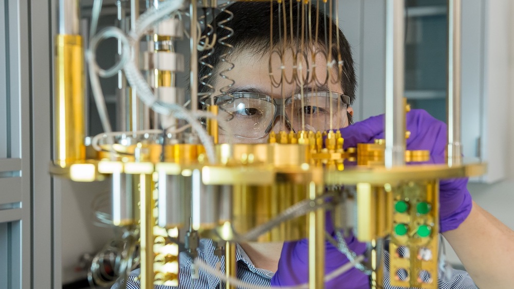 Capabilities at the Quantum Matter and Devices laboratory at Argonne’s Center for Nanoscale Materials, a U.S. Department of Energy Office of Science User Facility, aid in development of quantum materials and devices. Here, Argonne scientist Dafei Jin observes a dilution refrigerator, a cryogenic cooling device for materials used for quantum computing. (Image by Mark Lopez / Argonne National Laboratory.)